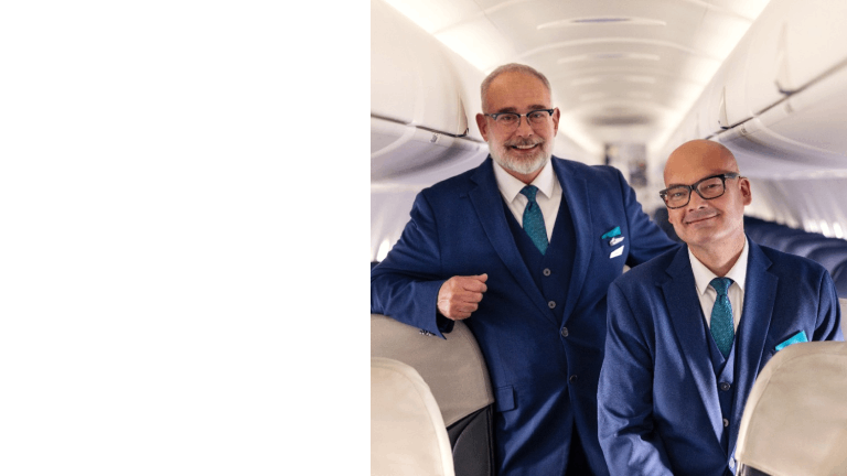 WestJetters sitting in asile on De Havilland Dash 8-400