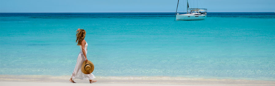 Person walking on beach in Nassau